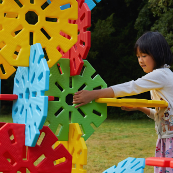 Children building with large toys from Polydron